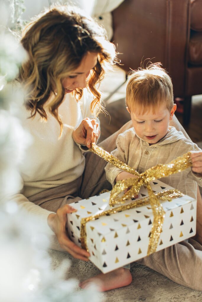 Festive holiday gift boxes with tennis and fitness accessories wrapped